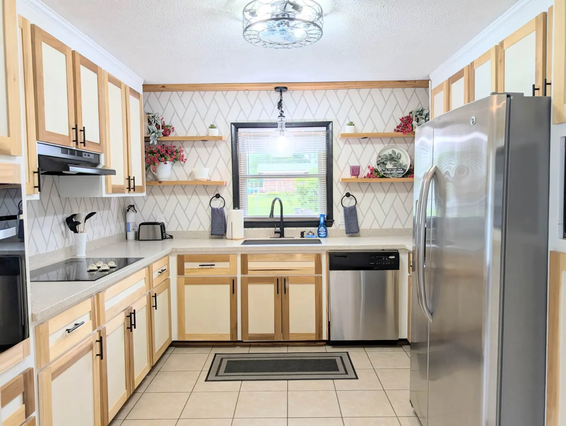 Fully furnished rental kitchen with appliances and a well-appointed workspace